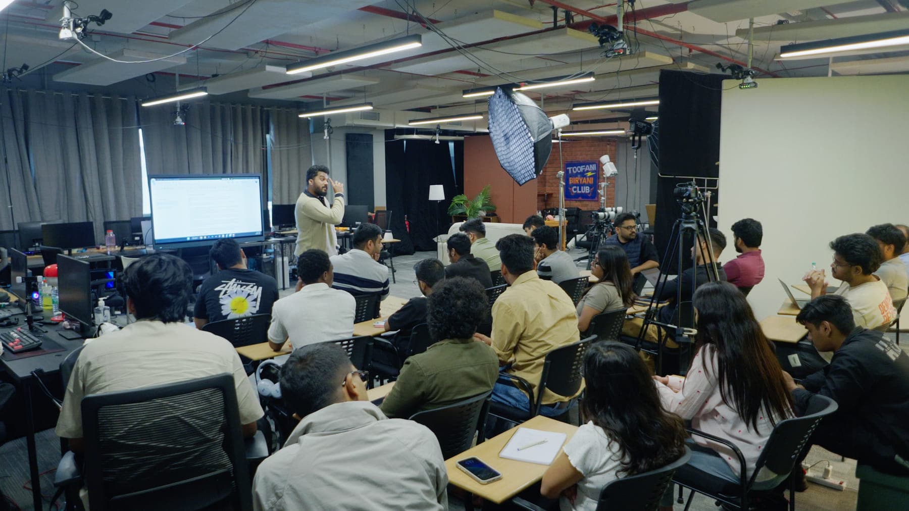 A full GenC class at the studio in Bangalore, lights and cameras set up around the room
